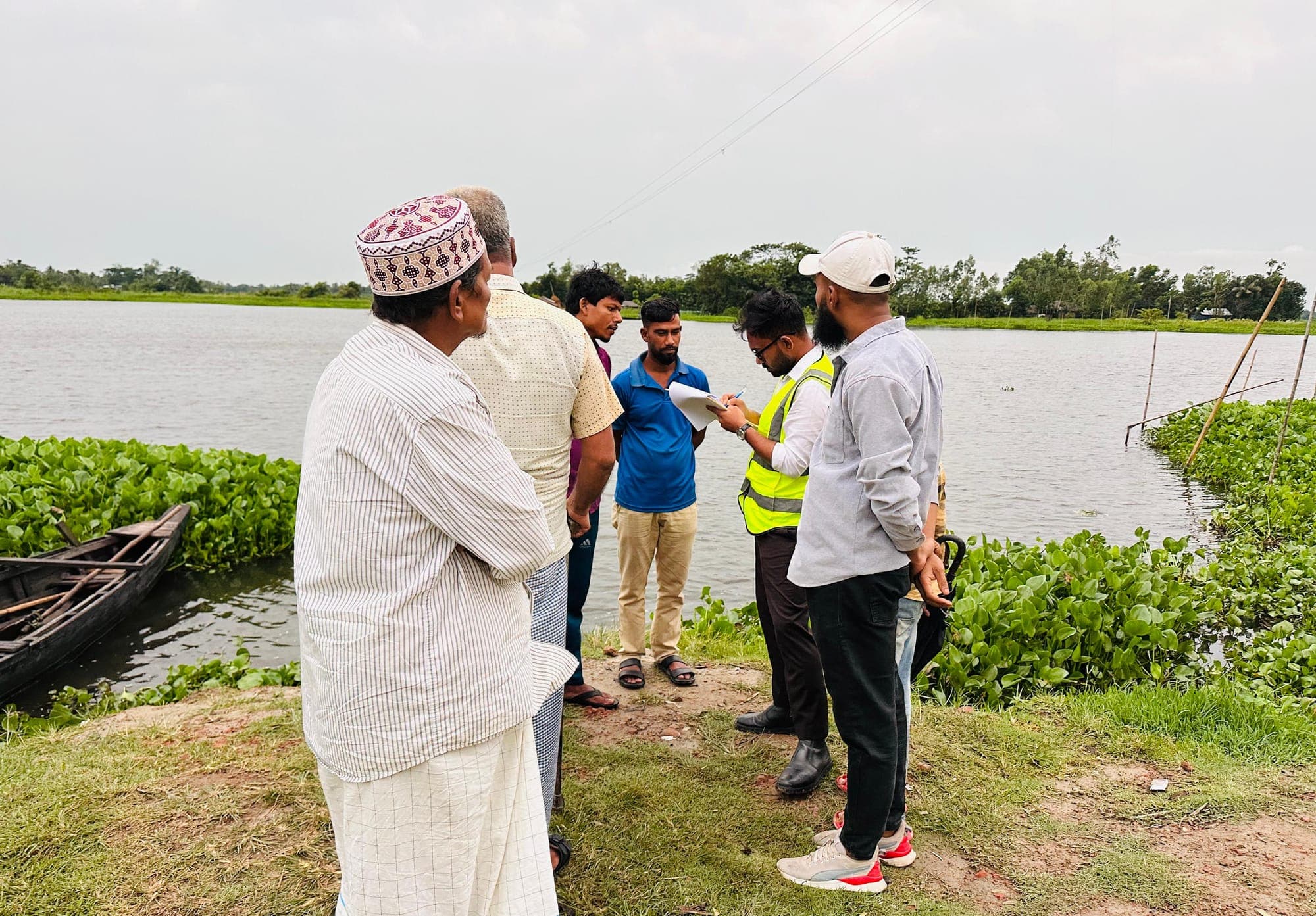 Fishers on a Bangladesh river where SRCL conducts socioeconomic survey work.