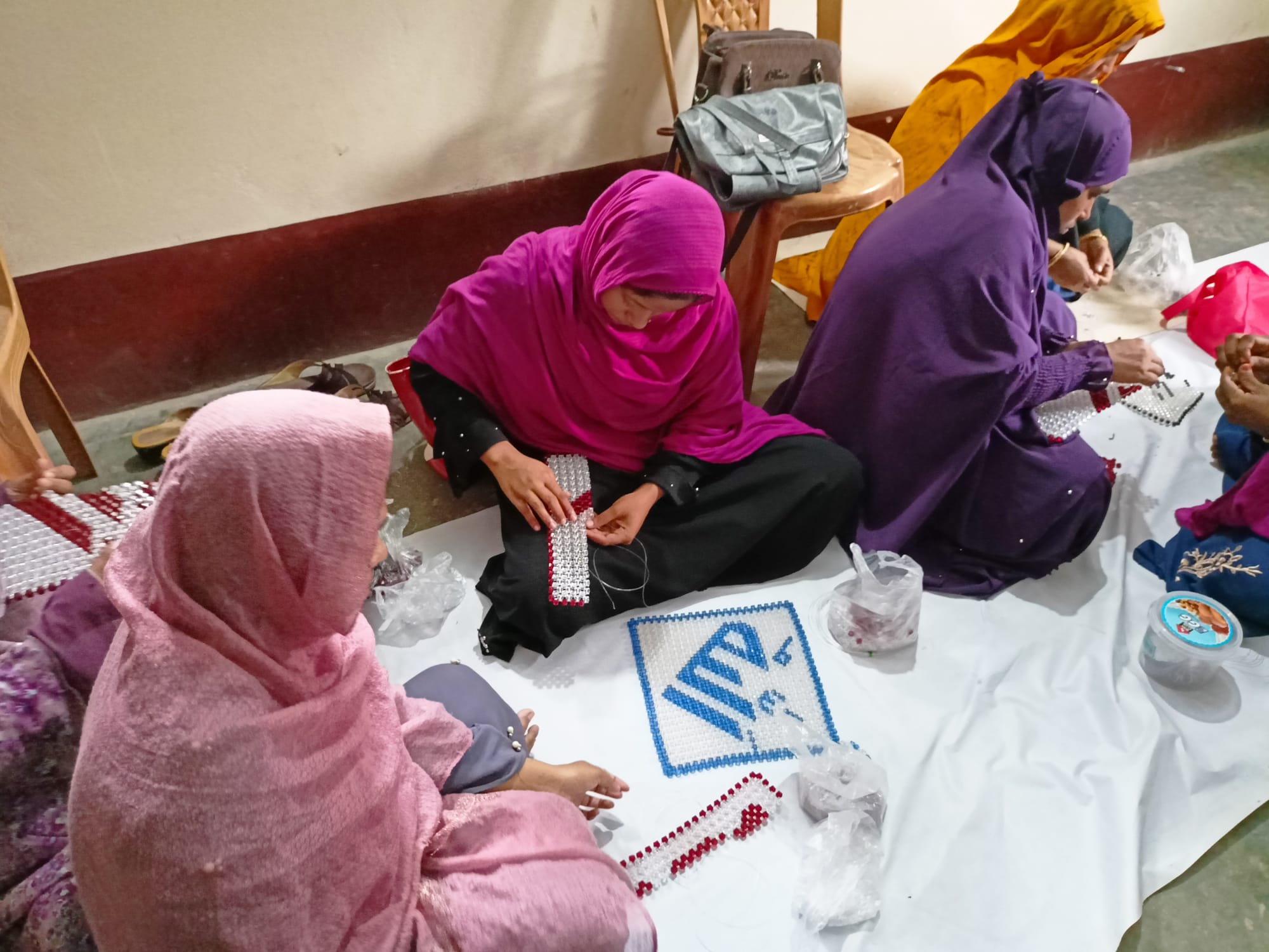 SRCL field team working with a community in Bangladesh.